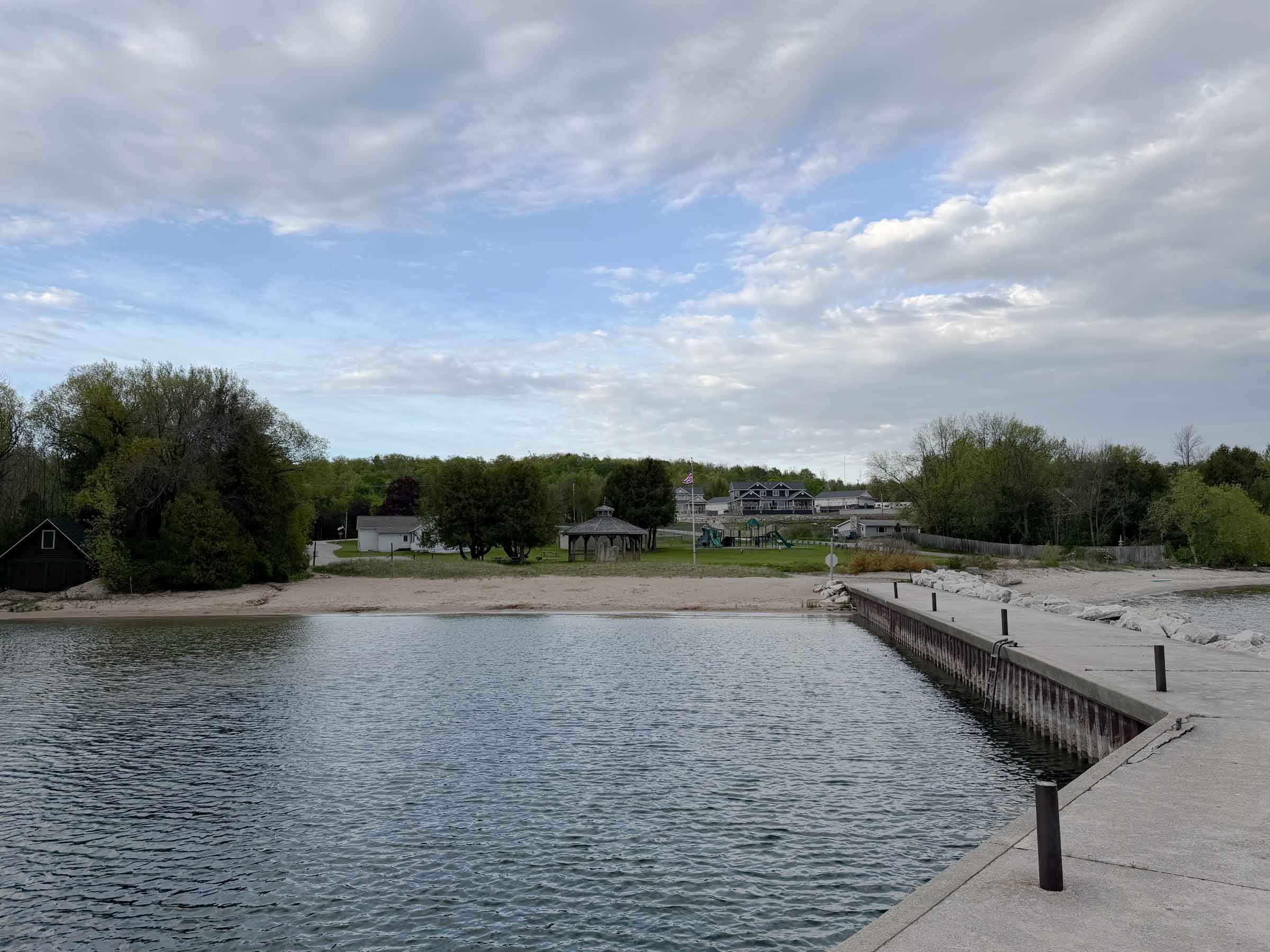 The pier, beach, and playground at Ellison Bay Park, across the street from Parkside Inn
