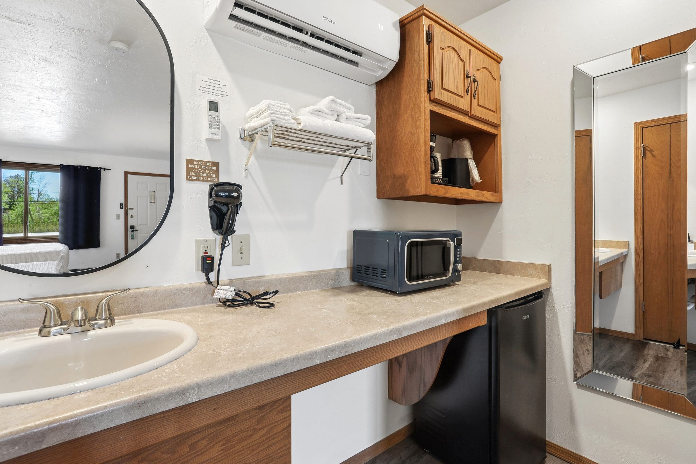 Kitchenette in a Two Queen Room with microwave, mini-fridge, coffee maker and vanity sink